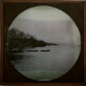 [Unidentified lake with moored rowing boats]