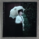 [Portrait of woman with umbrella]
