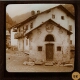 [Decorated building in village in mountainous landscape]
