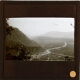 [Town at confluence of two rivers in mountainous landscape]