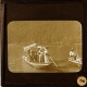 [Men and women in local costume in boats on lake]
