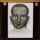 [Face of native man with tattooed pattern]