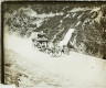 [Horse-drawn coach on road in rural landscape]