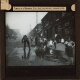 [Street scene with children and man]