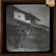 [Buildings and street in unidentified town or city]