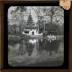 [Pagoda and lake in park]