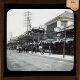 [Shops and houses in street in Japanese town or city]