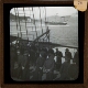[Crew members parading on deck of sailing ship]