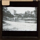 [Bridge across river at unidentified town or village]