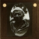 [African man wearing cap decorated with buttons]