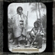 [Two tribesmen, one holding rifle]