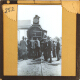 [Group of people standing in front of railway locomotive]